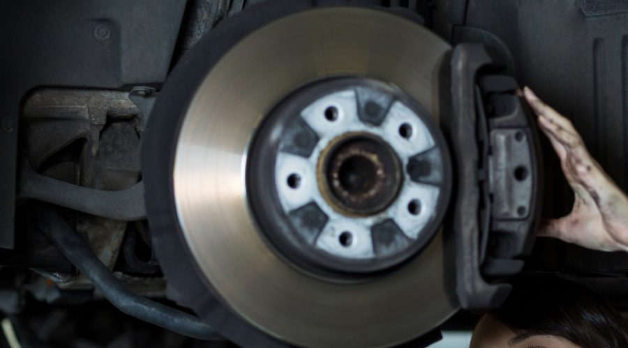 Optimized-female-mechanic-fixing-car-wheel-disc-brake-1